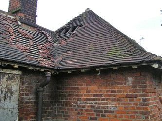 Falling roof tiles on public toilet in South London