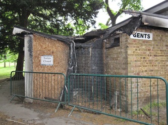 Derelict and fire damaged  London toilets in a South London park