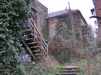 Overgrown steps down to abandoned platform of the closed down Crouch End station