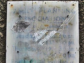 A faded old Family Planning sign was visible on the front of the building