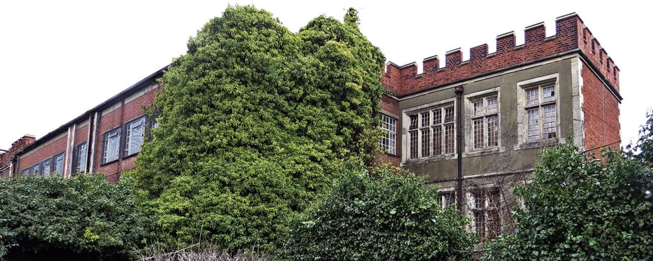 Overgrown derelict and overgrown parts of  Springfield Hospital in Tooting, South London
