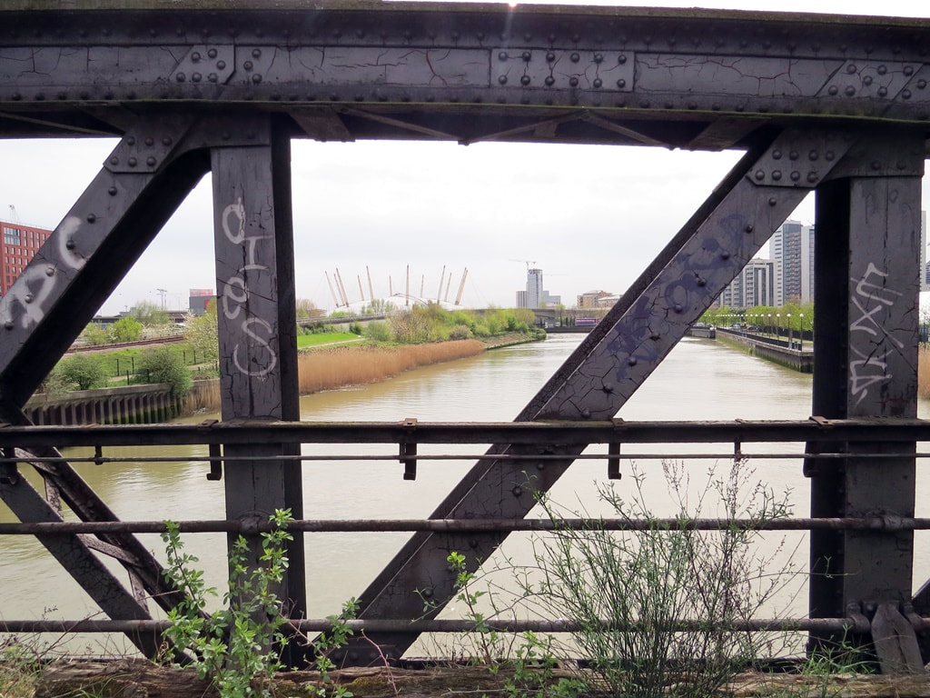 View of the O2 Millenium Dome and the River Lea from abandoned railway bridge at Canning Town