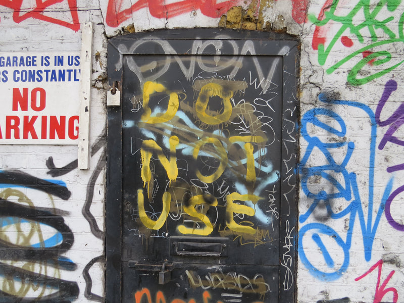 Abandoned doorways covered in graffiti on Derelict London Walking Tour 