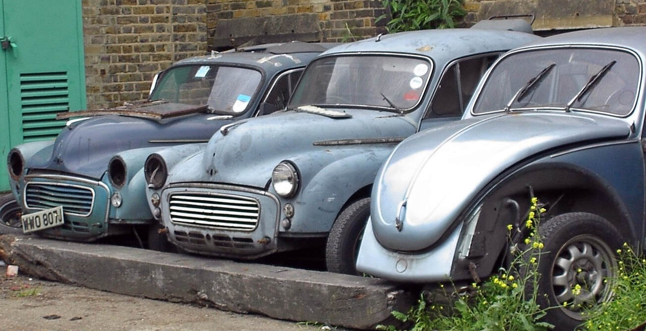 Available for spares? wrecked cars. Morris Minors and VW Beetle in Deptford SE8