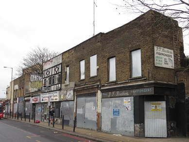 boundary between Stepney and Limehouse  crosses the Commercial Road (A13) to the left of the cab office