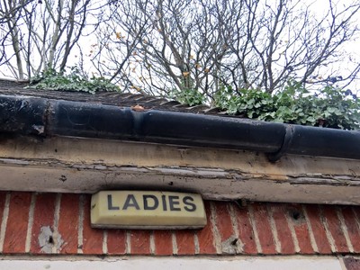 Ladies toilet sign in disused block in SE London