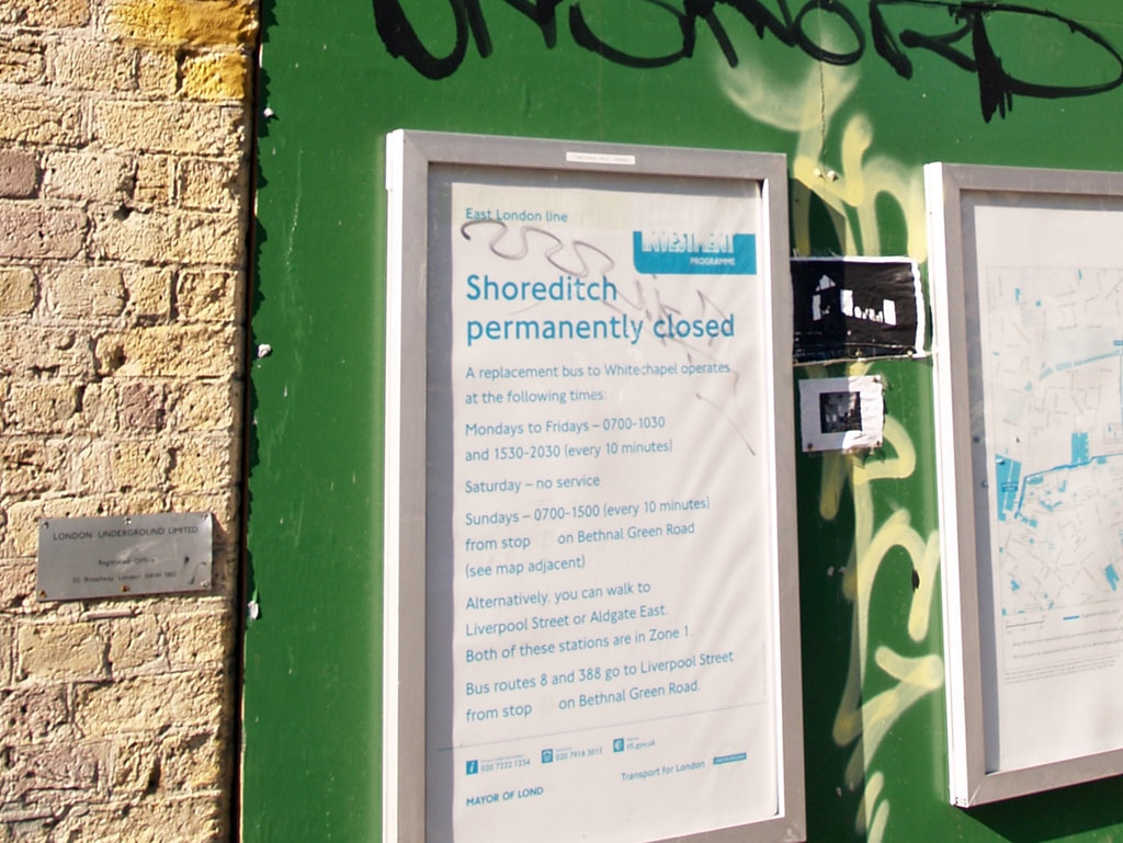 Shoreditch permanently closed sign at disused East London Line station off Brick Lane