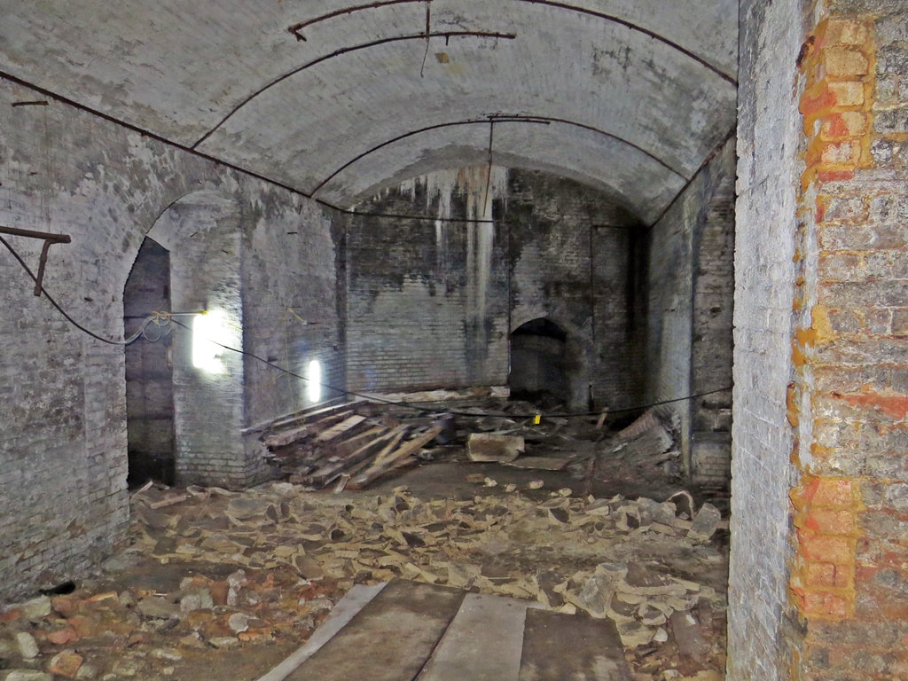 Below Smithfield Market. During recent preparatory work on the site for Museum of London  many bricked up vaults and cellars were discovered containing  a large amount of rats. 