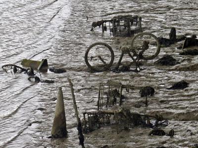 abandoned supermarket shopping trolleys, a bicycle and traffic cone in the River Medway