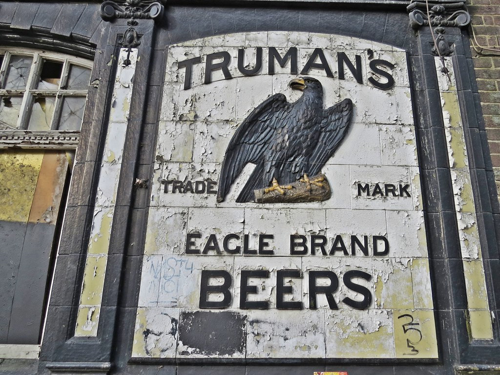 The Truman's Brewery eagle symbol at the derelict Victoria pub on the Woolwich Road
