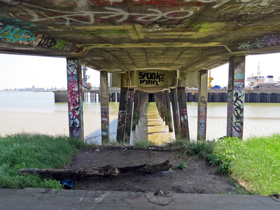 Underneath a jetty along the Thames in Thurrock