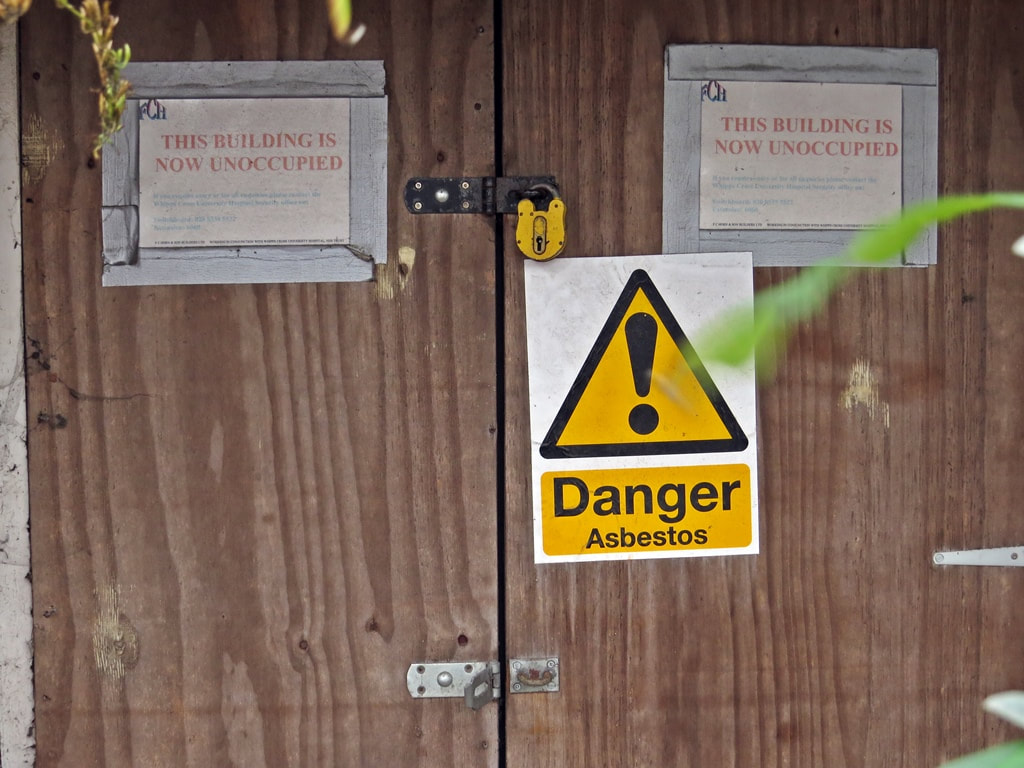 Danger sign at contaminated hospital site in East London