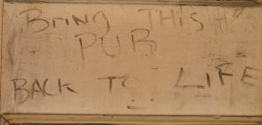 Bring this pub back to life graffiti on dead pub