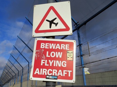 Beware Low Flying Aircraft sign on Paul Talling's Derelict London walking tour of Silvertown which starts at London City Airport