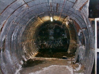 Dark abandoned tunnel  inside disused Aldwych (Strand) Underground Station