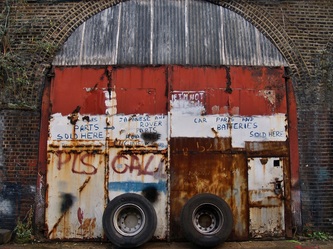 Scrap tyres and boarded up railway arches in South London