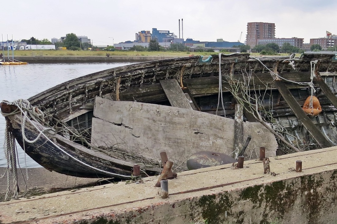 Picture Derelict London boat by Royal Docks under flightpath of City Airport
