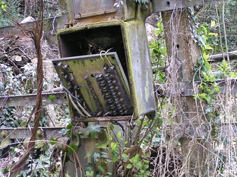 Abandoned electrical box at derelict railway station in Highgate, London