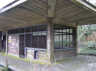 Central platform with reinforced concrete canopies at the abandoned Highgate station