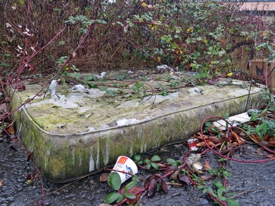 Abandoned mattress amongst fly tipping in Newham, East London