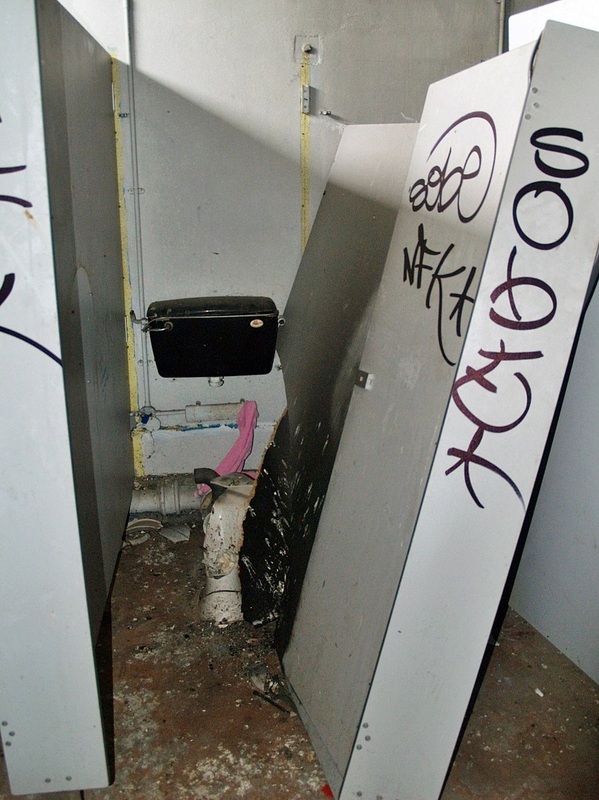 Vandalised toilet cubicle in Feltham 
