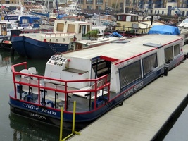 Picture  of disused water bus of Olympic and Paralympic passenger boat service along the Lea