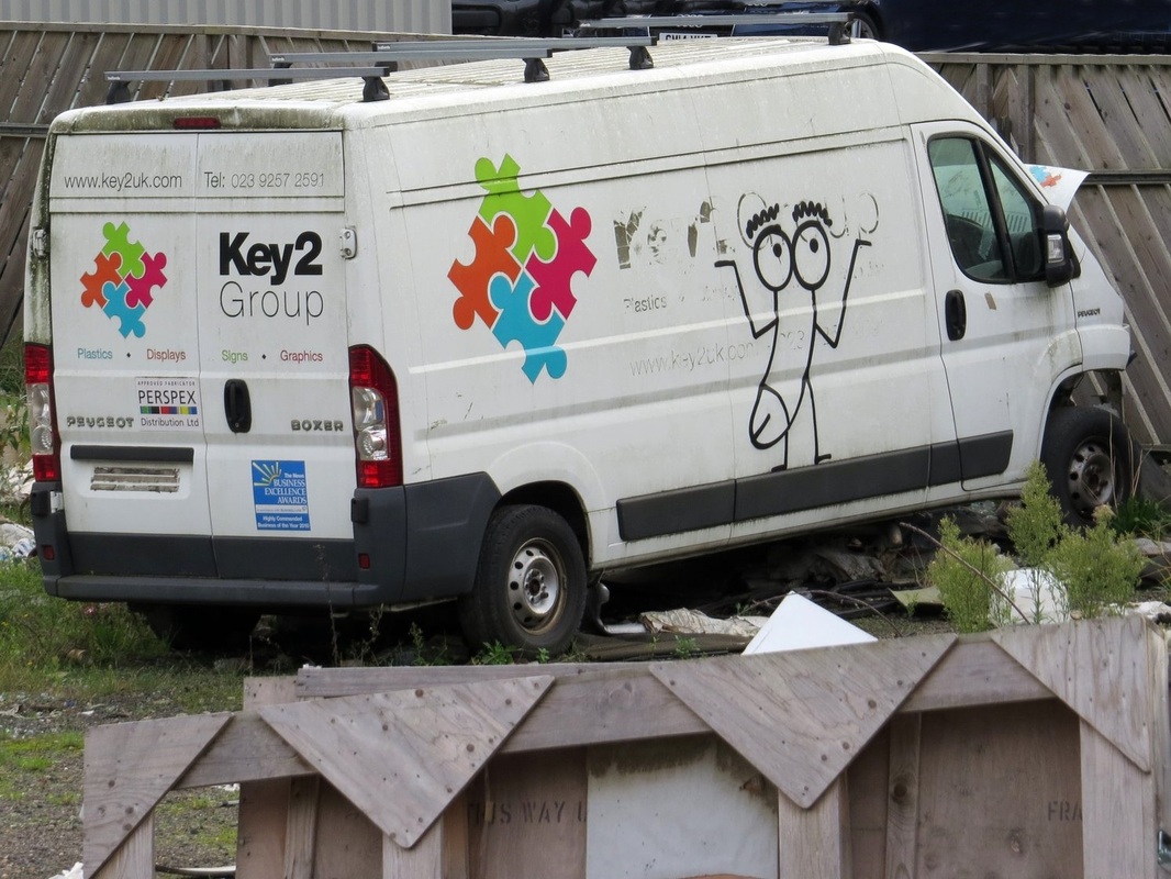 vandalised white van with grafitti in Bow, East London