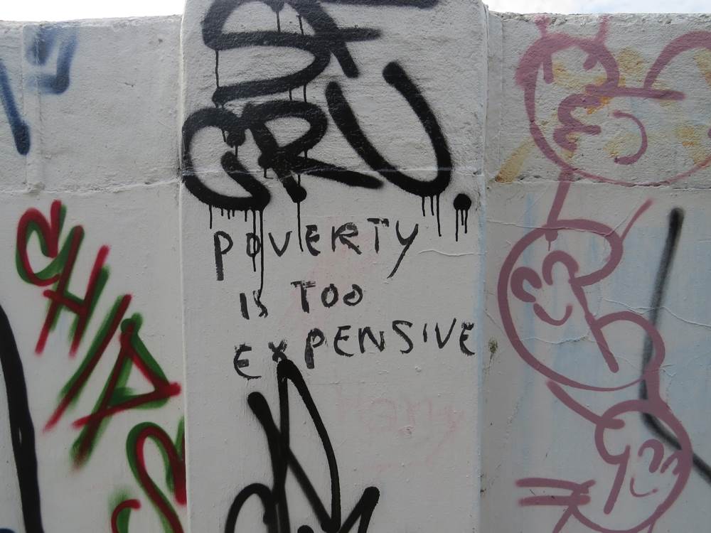 Poverty is so Expensive graffiti (in Mile End) by the Regents Canal