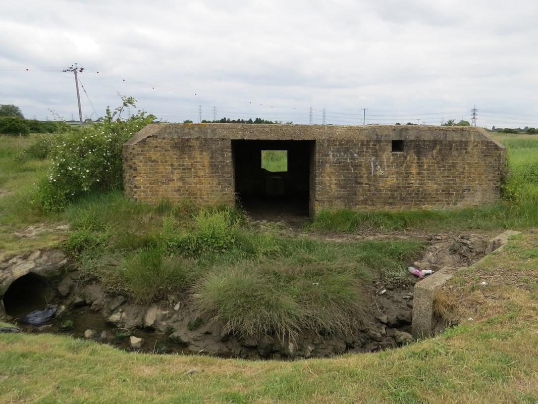 Picture of Derelict Pillbox at Hoo Stop Line. The line across the Hoo peninsula took the form of an artificial anti-tank ditch dug to join the Medway and Thames rivers. This was supported by pillboxes, anti-tank rails and road blocks.