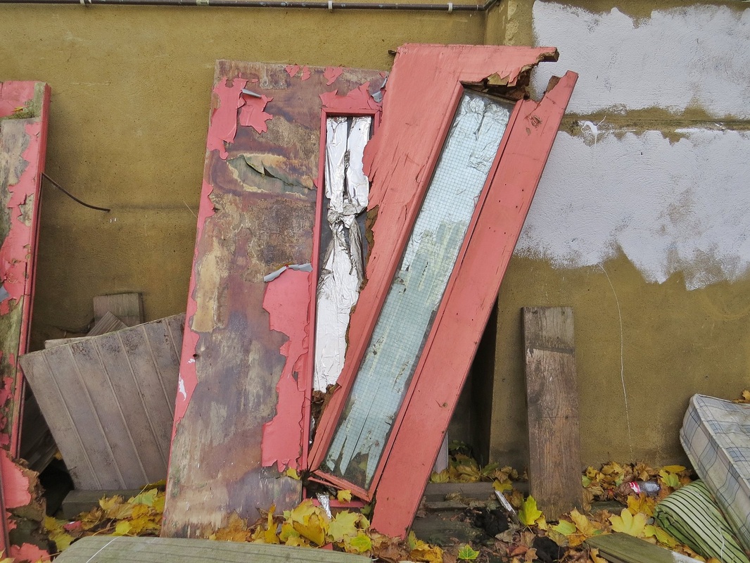 Decaying redundant doors dumped in Camberwell