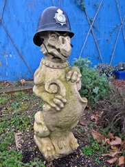 Dulwich Hospital Garden sculpture from demolished building with policeman's helmet