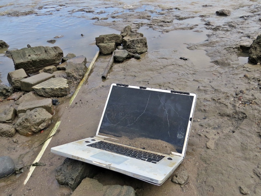Picture of abandoned laptop in the River Thames on the foreshore in Deptford, SE8