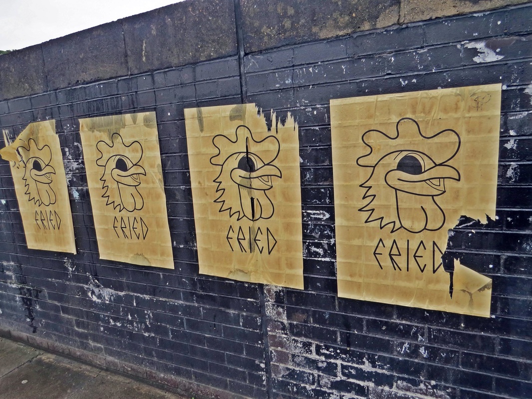 Fried chicken streetart posters in New Cross, South London