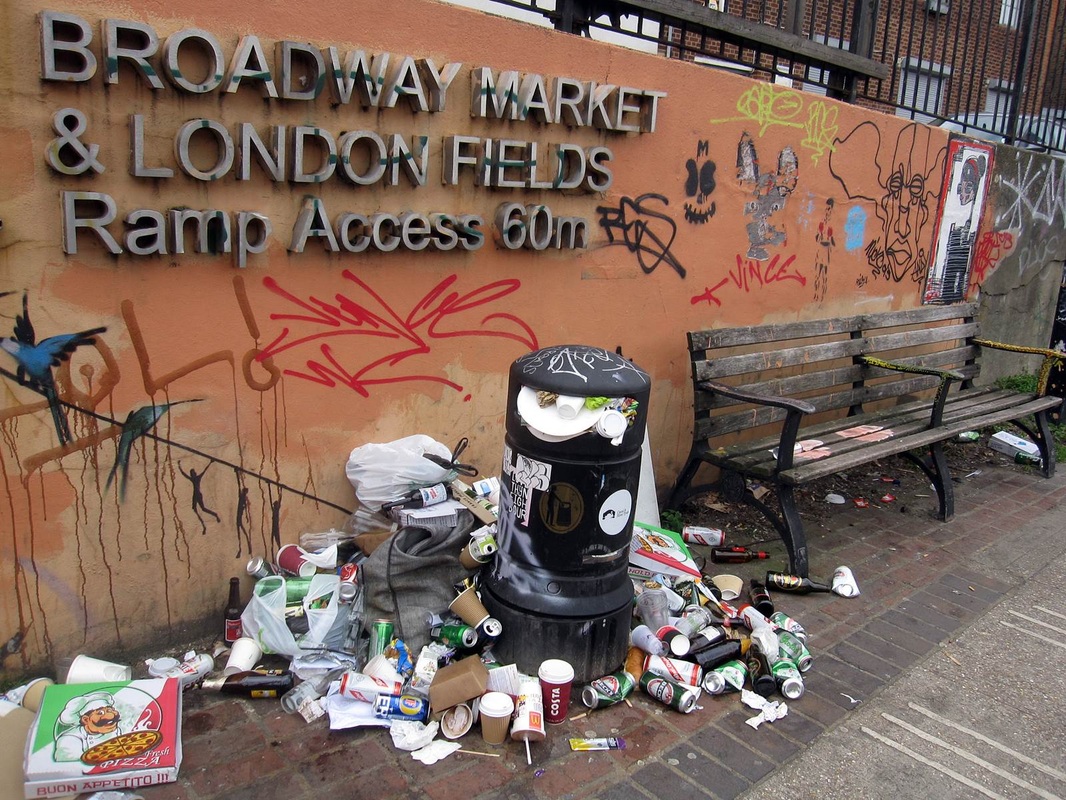 overflowing bins and rubbish dumped beside the canal at Broadway Market, London Fields