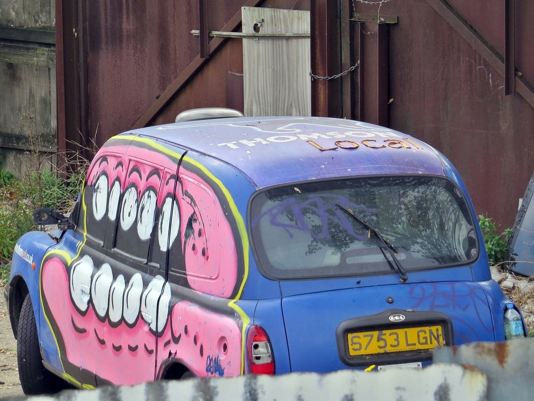 sweettooth streetart on London taxi in East London