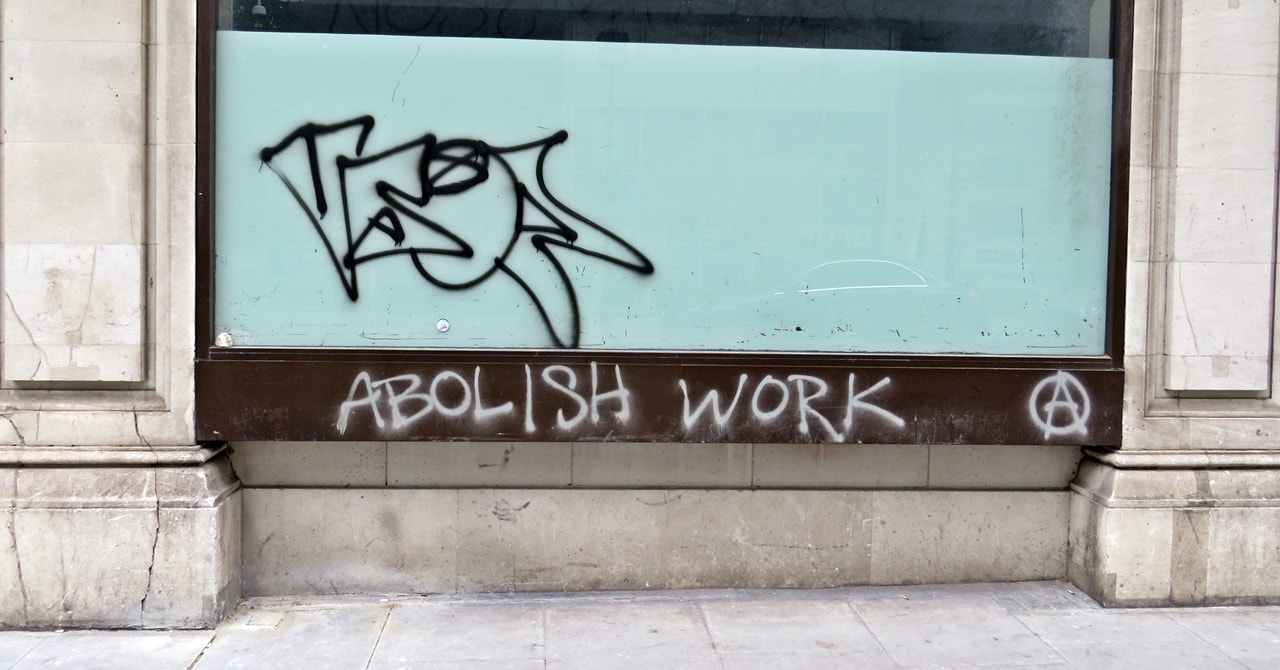 Abolish work anarchist graffiti on a window in London 