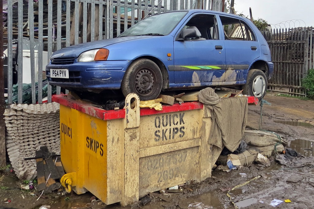 Scrap Toyota on a skip in East London, E14