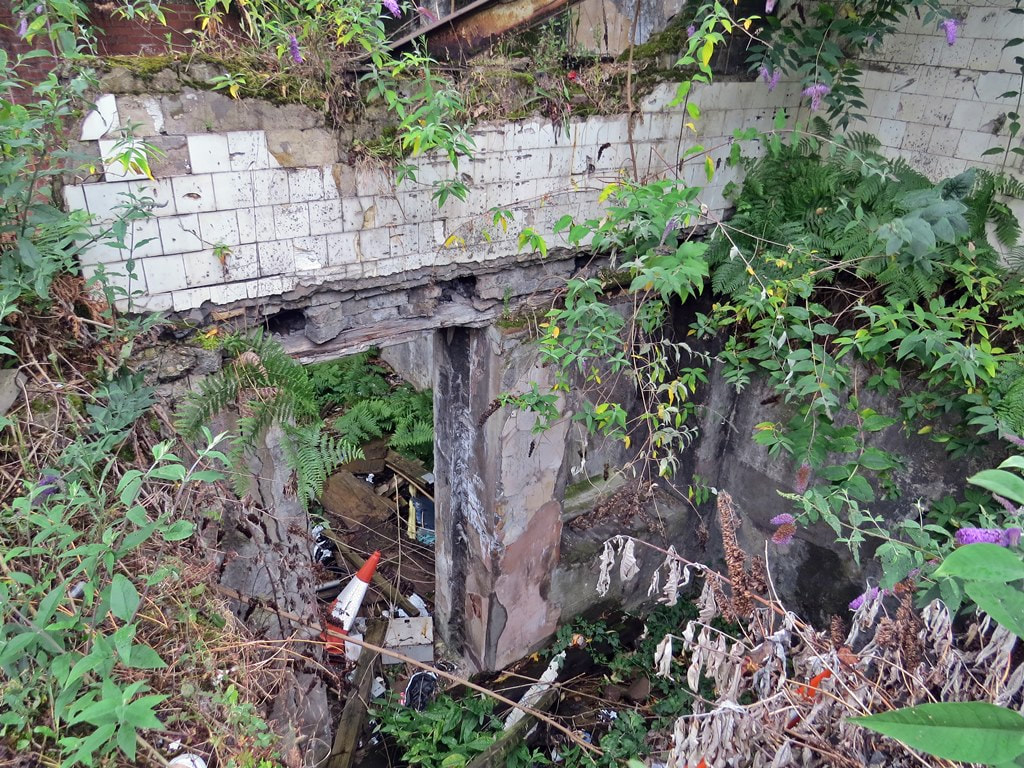 Derelict remains of abandoned entrance to Aldgate East London Underground station