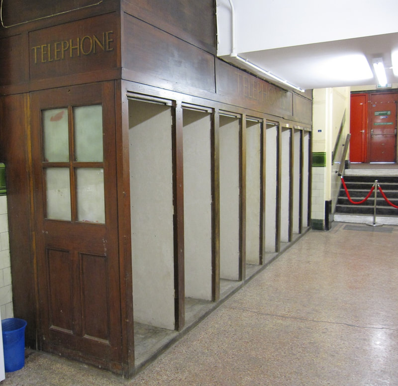 Wooden public telephone booths inside disused Aldwych Underground Station
