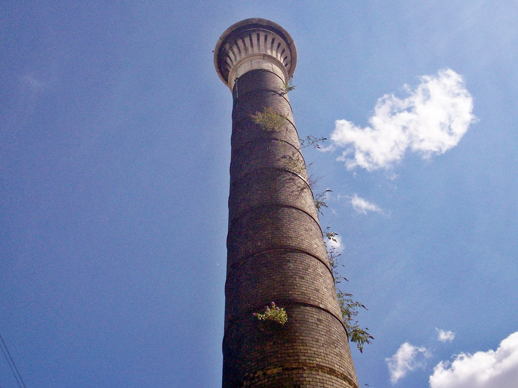 Abandoned Victorian Chimney against the blue sky of Beckton Sewage works