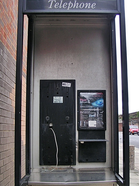 Broken payphone in South London