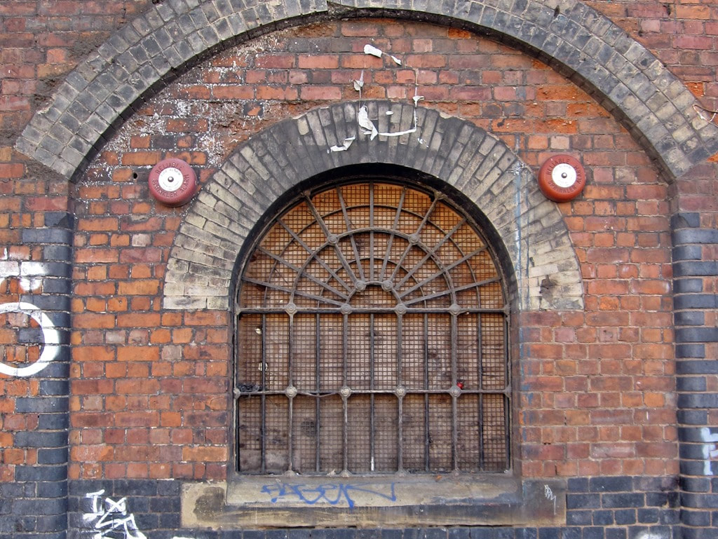 Elaborate arched windows at neglected remains of Bishopsgate Goodsyard in Shoreditch