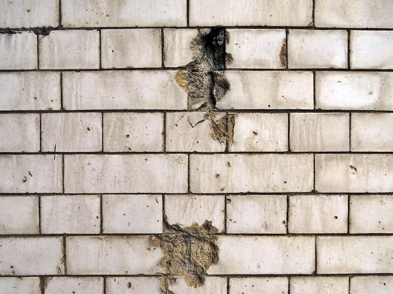Evidence of World War Two shrapnel damage in the tiling on the Blackfriars Road opposite Southwark Station