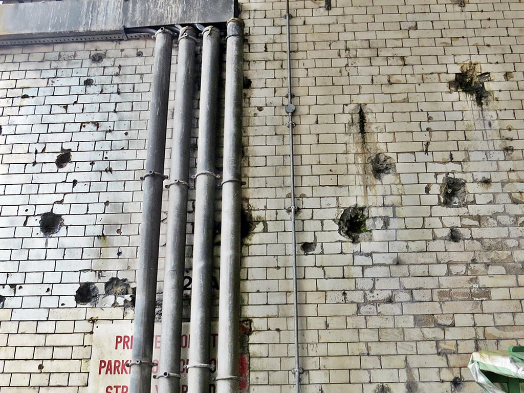 Bomb damage under the arches of a closed down London railway station