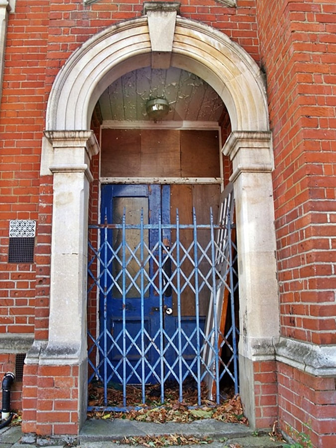Derelict entrance to the closed down Brentford Swimming Pool in London