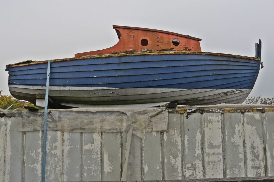 Picture of a small boat on a storage container in Brentford, West London