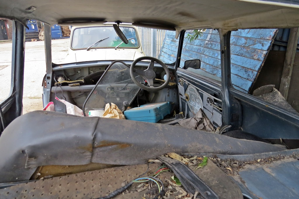 Interior of trashed Austin Mini 