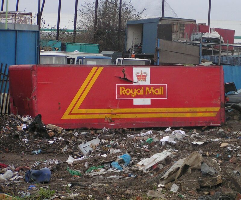 Abandoned Royal Mail lorry on wasteland in East London