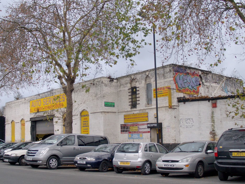 Cars outside the defunct Camberwell Railway Station now an auto services workshop