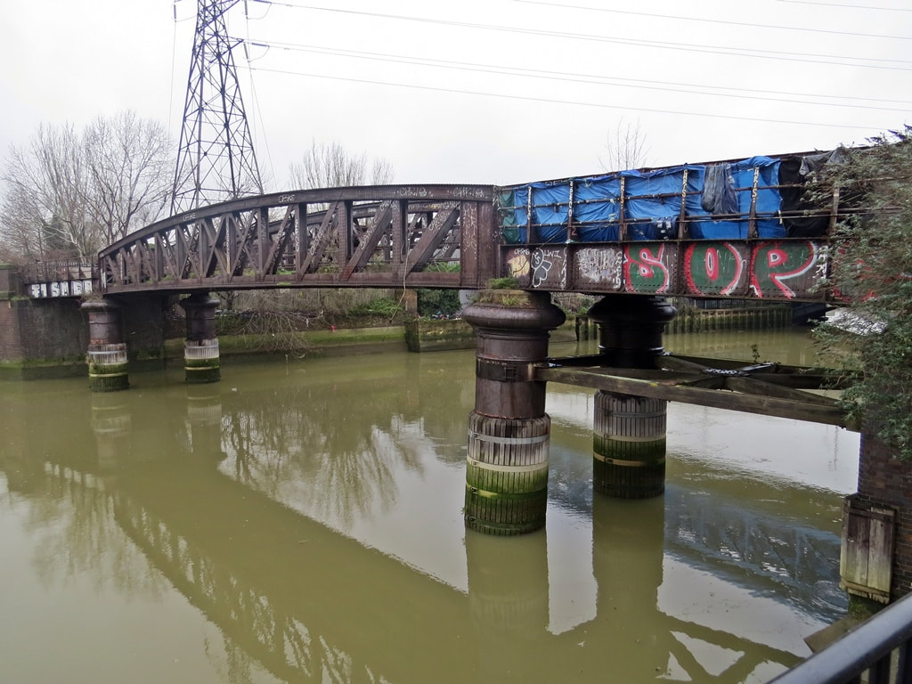 Disused goods railway bridge across the Bow Creek in  ​Canning Town, E16 